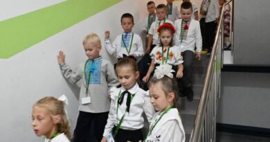 Pupils walk down a stairwell on the first day of the new school year at an underground school, wich was built to protect children from Russian missile attacks, in Kharkiv on September 1, 2025, amid the Russian invasion of Ukraine.