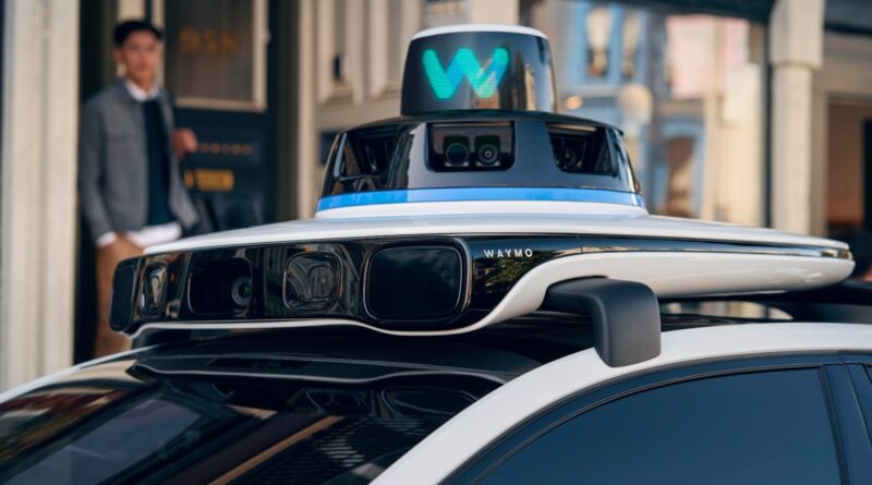 A close up of the rooftop of a Waymo robotaxi that shows sensors.