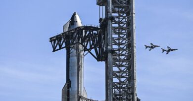 TOPSHOT - US billionaire businessman and pilot Jared Isaacman flies in formation aboard a fighter jet over the SpaceX Starship spacecraft, before his third test flight from Starbase in Boca Chica, Texas, on March 13, 2024. Elon Musk's SpaceX announced it was eyeing March 14 as the earliest date for the next test launch of its giant Starship rocket, with which it hopes to one day colonize Mars. Two previous attempts have ended in spectacular explosions, though the company has adopted a rapid trial-and-error approach in order to accelerate development. (Photo by CHANDAN KHANNA/AFP via Getty Images)