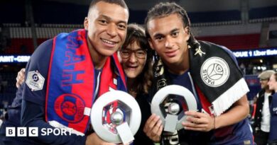 Kylian Mbappe and his brother Ethan along with their mother