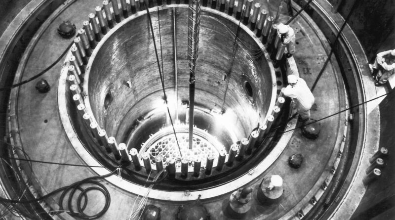 Engineers look inside a nuclear reactor.