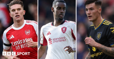 Harry Kane claps while playing for England