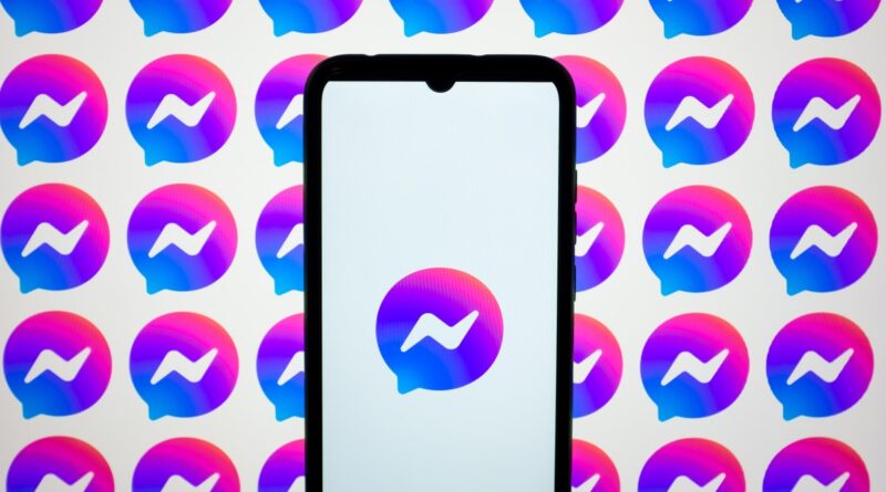 In this photo illustration, Messenger logos are displayed on a smartphone screen and on a computer screen.