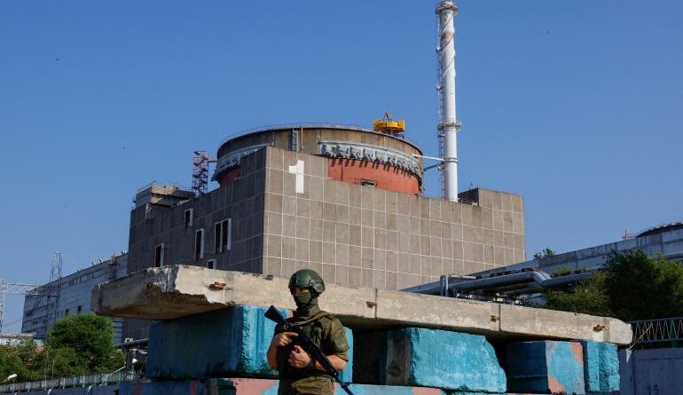 A Russian service member stands guard at a checkpoint near the Zaporizhzhia Nuclear Power Plant [FILE: Alexander Ermochenko/Reuters]