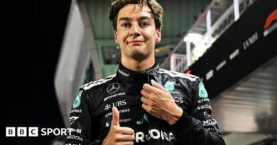 Mercedes' George Russell gives the thumbs-up signal after taking pole position for the Singapore Grand Prix