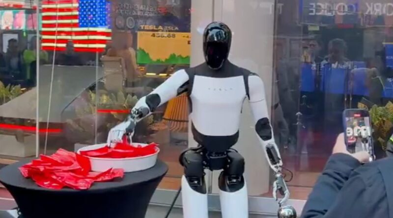 Tesla's Optimus robot hands out candy in Times Square