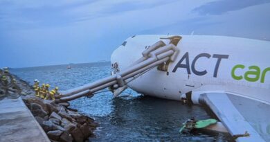 Two killed as cargo plane skids off Hong Kong runway