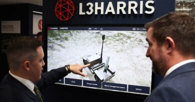 Representatives present a defense system at the L3Harris stand during the 33rd International Defence Industry Exhibition (MSPO) in Kielce, Poland, on September 2, 2025.