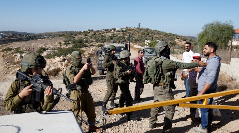 ‘Armed, dangerous’: Israeli settlers attack Palestinians harvesting olives