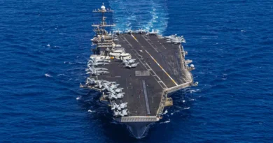 A US aircraft carrier's hard turn to avoid enemy fire surprised sailors and sent a jet with bad brakes into the sea
