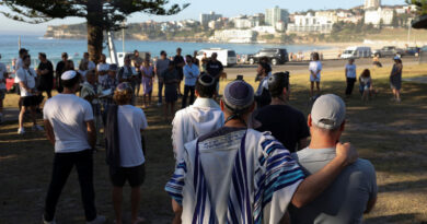 Australian Jews hold prayers, hundreds of surfers paddle out at Bondi to honour shooting victims