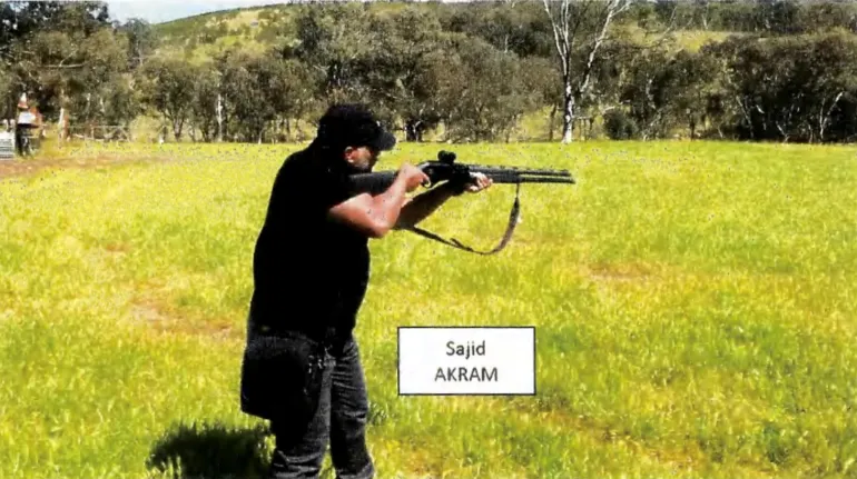 Sajid Akram, one of the suspects in the shooting during a Jewish Hanukkah celebration at Bondi Beach on December 14, conducting firearms training at a location suspected to be in New South Wales, Australia, in this still image taken from a court document released December 22, 2025. NSW Police/Handout via REUTERS THIS IMAGE HAS BEEN SUPPLIED BY A THIRD PARTY NO RESALES. NO ARCHIVES. MANDATORY CREDIT. TEXT OVERLAY FROM SOURCE