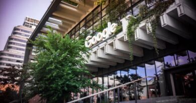 The Google logo on the exterior of the renovated St. John’s Terminal, with greenery hanging from the building.