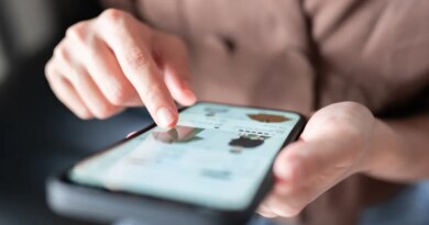 Woman's hands pointing to an item in an online shop on her smartphone, used in a post about FLIK