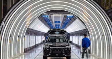 Electric vehicles on the assembly line at the BYD Co. factory in Zhengzhou, Henan province, China