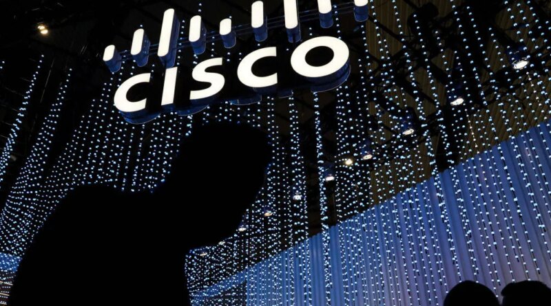 An illuminated logo above the Cisco Systems Inc. stand on the opening day of the MWC Barcelona at the Fira de Barcelona venue in Barcelona, Spain, on Monday, Feb. 28, 2022. Over 1,800 exhibitors and attendees from 183 countries will attend the annual event, which runs from Feb. 28 to March 3. Photographer: Angel Garcia/Bloomberg