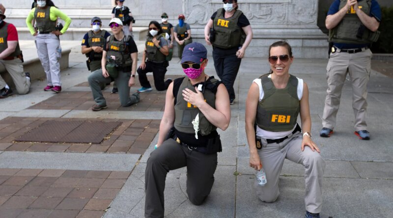 FBI agents allege wrongful termination for kneeling during US protest