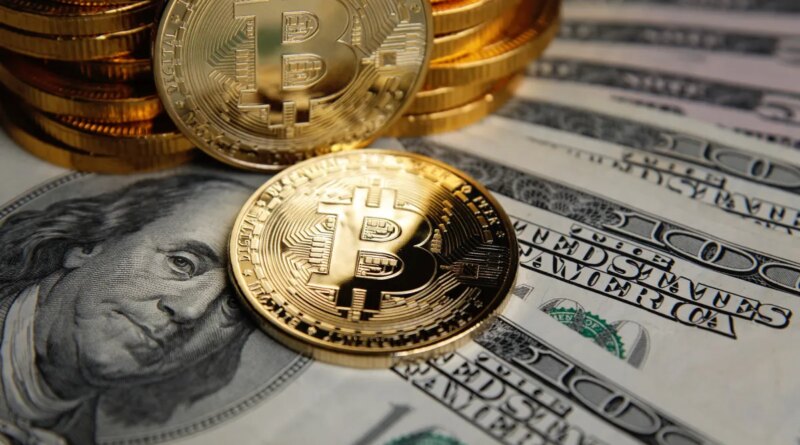 Bitcoin coins cryptocurrency on U.S. dollar banknotes background.