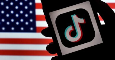 In this photo illustration, the social media application logo, TikTok is displayed on the screen of an iPhone on an American flag background on August 3, 2020 in Arlington, Virginia. - The US Senate voted on August 6, 2020, to bar TikTok from being downloaded onto US government employees' telephones, intensifying US scrutiny of the popular Chinese-owned video app. The bill passed by the Republican controlled Senate now goes to the House of Representatives, led by Democrats. (Photo by Olivier DOULIERY / AFP) (Photo by OLIVIER DOULIERY/AFP via Getty Images)
