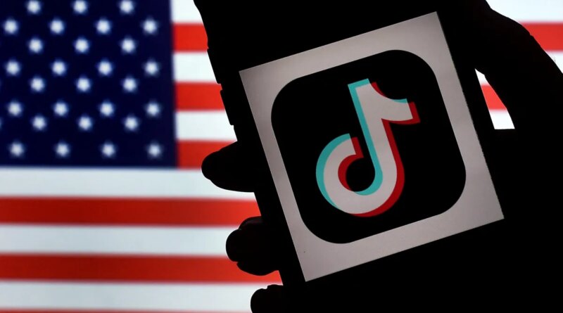 In this photo illustration, the social media application logo, TikTok is displayed on the screen of an iPhone on an American flag background on August 3, 2020 in Arlington, Virginia. - The US Senate voted on August 6, 2020, to bar TikTok from being downloaded onto US government employees' telephones, intensifying US scrutiny of the popular Chinese-owned video app. The bill passed by the Republican controlled Senate now goes to the House of Representatives, led by Democrats. (Photo by Olivier DOULIERY / AFP) (Photo by OLIVIER DOULIERY/AFP via Getty Images)