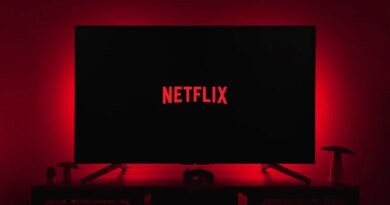 netflix logo on black screen backlit by red glow