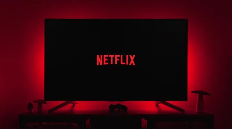 netflix logo on black screen backlit by red glow
