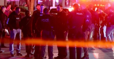 Police gather on Waterman Street in Providence, R.I., on Saturday, Dec. 13, 2025, during the investigation of a shooting. (AP Photo/Mark Stockwell)