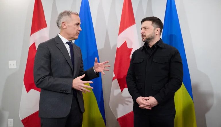 HANDOUT / UKRAINIAN PRESIDENTIAL OFFICE / AFPCopy Photo by HANDOUT / UKRAINIAN PRESIDENTIAL OFFICE / AFP This handout photograph taken on December 27, 2025 and released by the Ukrainian Presidential Office shows Ukraine's President Volodymyr Zelensky (R) and Canadian Prime Minister Mark Carney speaking to the press as they meet in Halifax, Nova Scotia, Canada. Establishing a lasting peace in Ukraine requires "a willing Russia," Carney said Saturday, denouncing the "barbarism" of Moscow's latest bombardment of Kyiv as he met with Zelensky.