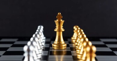 Golden Chess King and Pawn with Silver Colored Pawns on the sides