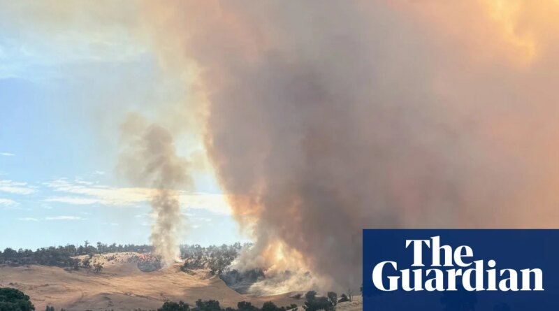WA bushfire downgraded while Queensland and NT brace for monsoonal rain and flooding