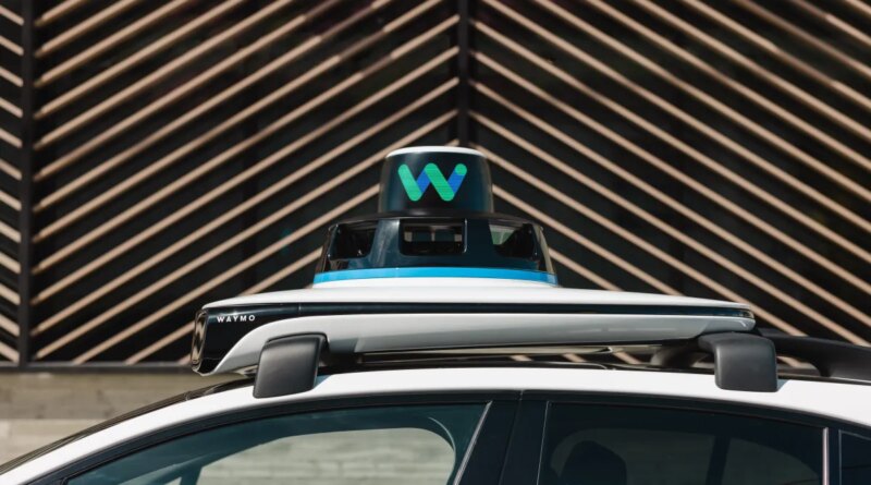 top of Waymo car, showing equipment on roof