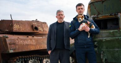 Bomb-sniffing deminer dog Patron and owner Mykhailo "Misha" Iliev, with Giles Duley, UN Global Advocate
