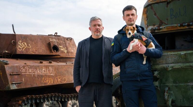 Bomb-sniffing deminer dog Patron and owner Mykhailo "Misha" Iliev, with Giles Duley, UN Global Advocate