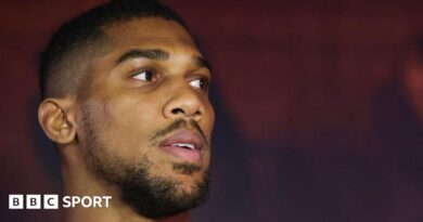 A picture of Anthony Joshua sat with four women