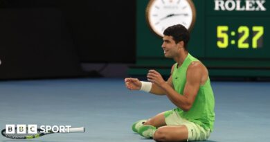 Carlos Alcaraz receives treatment from the physiotherapist during the third set against Alexander Zverev