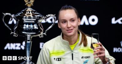 Elena Rybakina drinks champagne at her news conference after winning the Australian Open