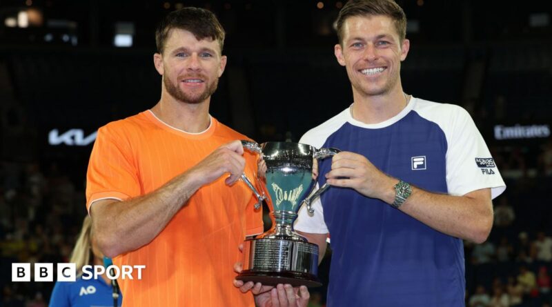 Christian Harrison and Neal Skupski hold the Australian Open men's doubles trophy