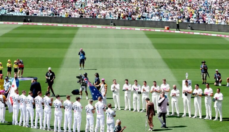 Emergency service personnel and members of the public who responded during a mass shooting at Bondi Beach including Ahmed al Ahmed (R), the man who tackled and disarmed one of the attackers, receive a guard of honour on day one of the fifth Ashes cricket Test match between Australia and England at the Sydney Cricket Ground (SCG) in Sydney on January 4, 2026. England and Australia's cricket teams honoured at the fifth Ashes Test in Sydney on January 4 emergency service personnel and members of the public who responded during a mass shooting at Bondi Beach. (Photo by Glenn NICHOLLS / AFP) / --IMAGE RESTRICTED TO EDITORIAL USE - STRICTLY NO COMMERCIAL USE--