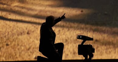 Nvidia founder and CEO Jensen Huang talks to a robot as he speaks during Nvidia Live at CES 2026 ahead of the annual Consumer Electronics Show in Las Vegas, Nevada, on January 5, 2026.