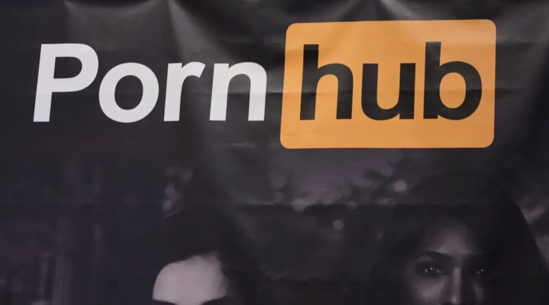 A sign hangs at the Pornhub booth at the 2023 AVN Adult Entertainment Expo at Resorts World Las Vegas on January 06, 2023 in Las Vegas, Nevada.