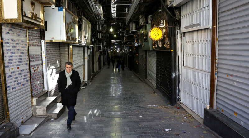 Iran's traders, frustrated by economic losses, turn against clerics