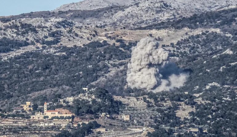 Smoke rises from the site of an Israeli airstrike that struck the hillsides near the southern Lebanese village of Al-Katrani on January 11, 2026.