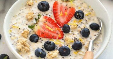 a bowl of chia pudding with berries and blueberries, similar to overnight oats.