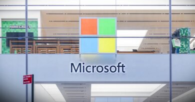 A Microsoft store entrance with the company's logo on top in midtown Manhattan