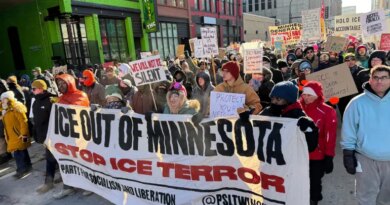 People participate in an anti-ICE rally Sunday, Jan. 25, 2026, in Minneapolis. (AP Photo/Jack Brook)