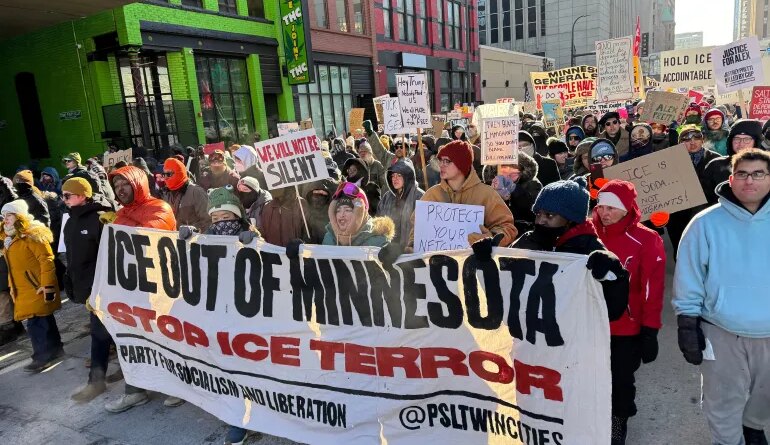 People participate in an anti-ICE rally Sunday, Jan. 25, 2026, in Minneapolis. (AP Photo/Jack Brook)