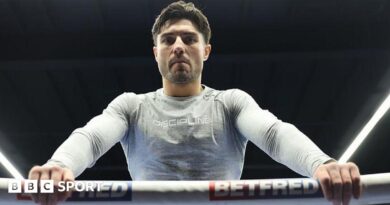 Josh Kelly leans over the ropes