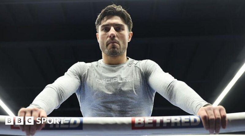 Josh Kelly leans over the ropes