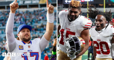 Josh Allen holds his arms aloft and Jauan Jennings celebrates with Upton Stout