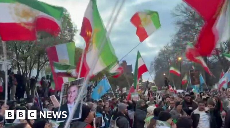 Protester climbs onto balcony of Iranian embassy in London